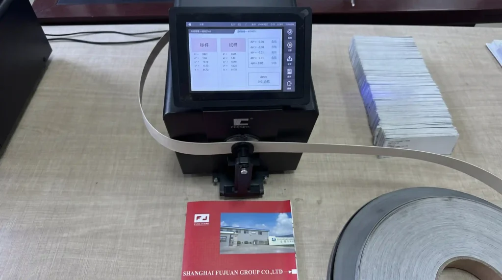 A technician at Fujuan Group uses a precise spectrophotometer for strict quality control, ensuring a 98% batch-to-batch color consistency for edge banding.
