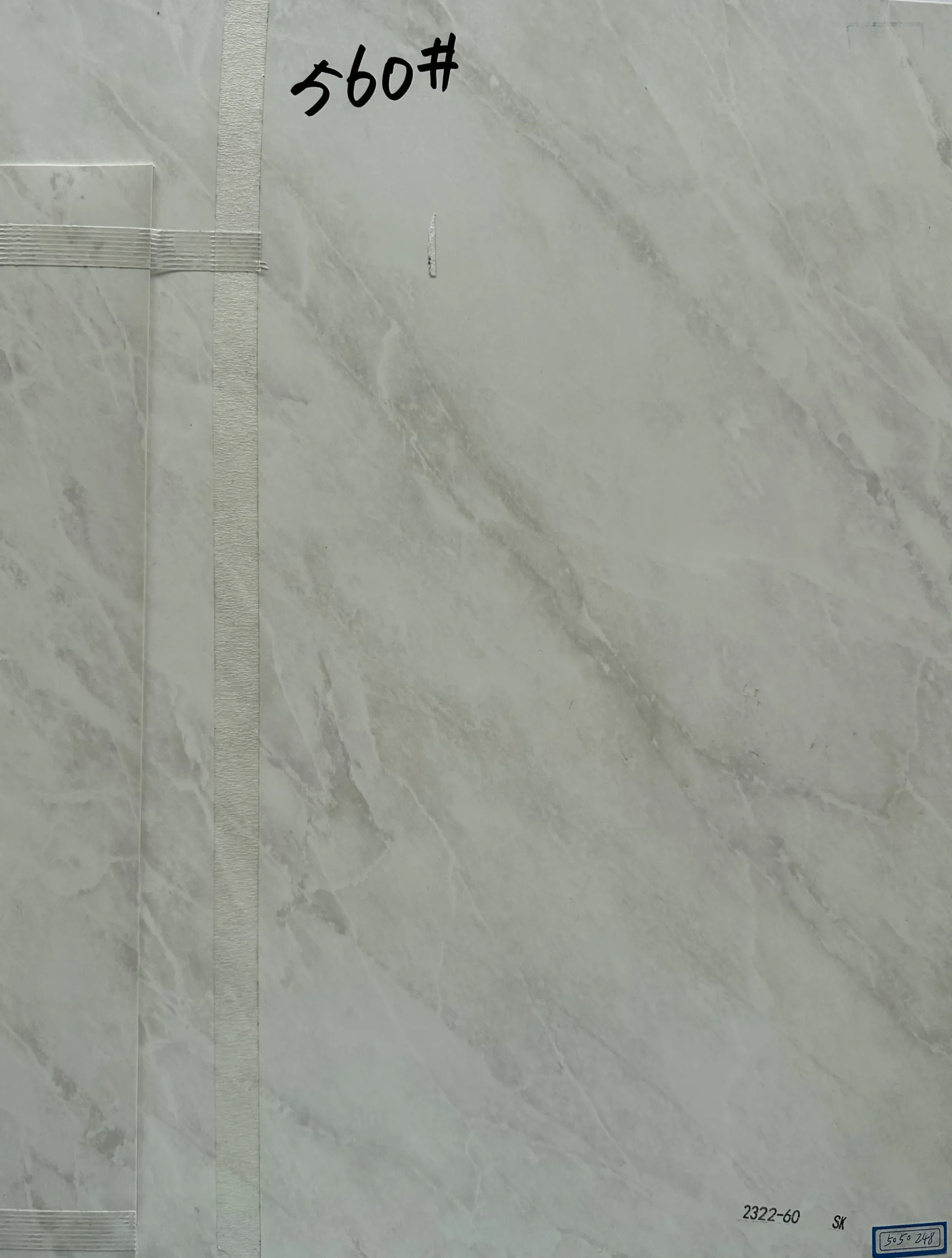 Light grey marble board sample with matching edge banding strip for made to order furniture surfaces 2322 60 SK