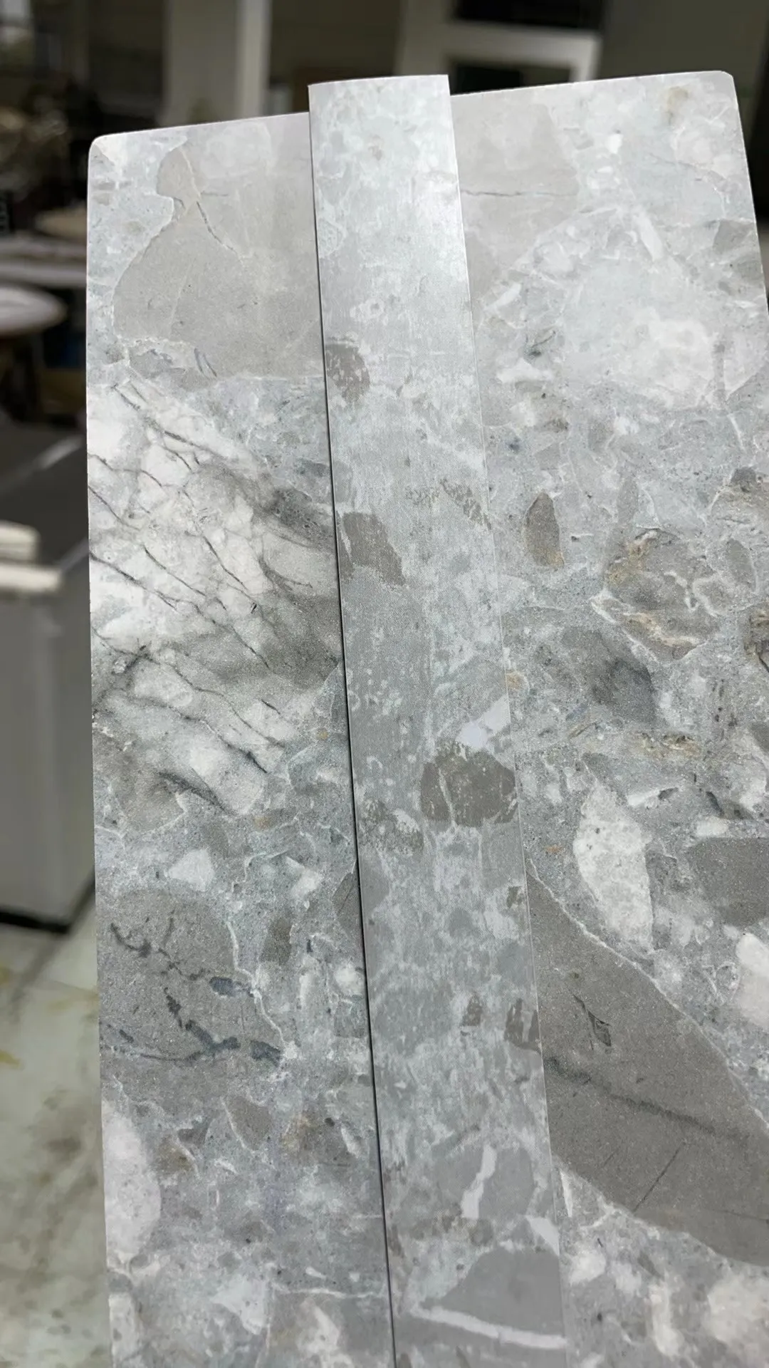 Fujuan light grey marble and terrazzo texture edge banding, suitable for seamless finishing of stone countertops and dining tables.